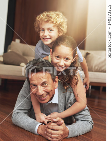 Portrait, home and grandfather on the ground, grandchildren and happiness with siblings or vacation. Face, apartment or elderly man with grandkids or bonding together with fun or playing with holiday Portrait, home and grandfather on the ground, grandchildren and happiness with siblings or vacation. Face, apartment or elderly man with grandkids or bonding together with fun or playing with holiday 140373215