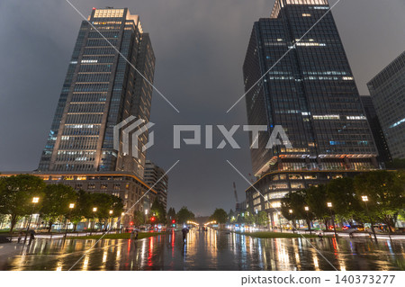 The streets of Marunouchi in front of Tokyo Station on a rainy night The streets of Marunouchi in front of Tokyo Station on a rainy night 140373277