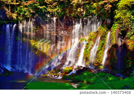 Shiraito Falls with a view of Mt. Fuji amidst the autumn foliage 140373408