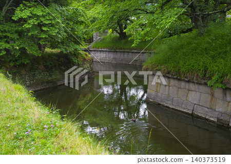 The moat and stone walls of Tatsuoka Castle in Nagano Prefecture The moat and stone walls of Tatsuoka Castle in Nagano Prefecture 140373519