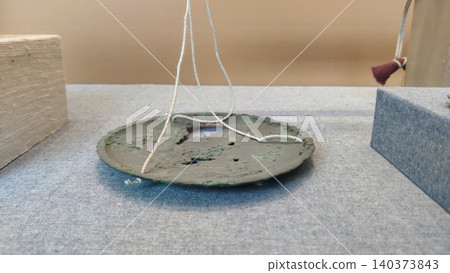 Brass weighing plate from ancient Harappan civilization site Brass weighing plate from ancient Harappan civilization site 140373843