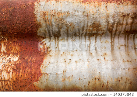 The surface of an old metal guardrail, severely rusted due to years of deterioration. The surface of an old metal guardrail, severely rusted due to years of deterioration. 140373848