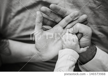 Parent and Child Hands Embracing Each Other Gently Parent and Child Hands Embracing Each Other Gently 140373988