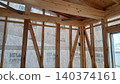 Construction site for a newly built wooden detached house 140374161
