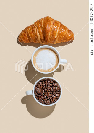 Cup of cappuccino, coffee beans and croissant on a yellow isolated background Cup of cappuccino, coffee beans and croissant on a yellow isolated background 140374299