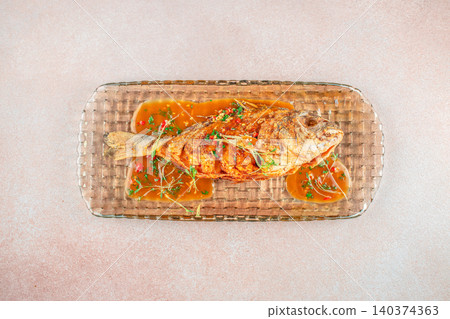 Top View of Whole Fried Dorado Fish with Spicy Sauce and Copy Space Top View of Whole Fried Dorado Fish with Spicy Sauce and Copy Space 140374363
