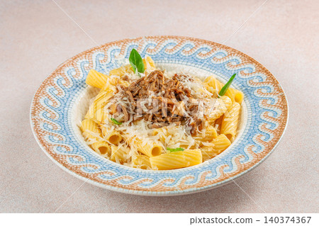 Rigatoni Pasta with Slow Cooked Meat Ragout and Parmesan Cheese Rigatoni Pasta with Slow Cooked Meat Ragout and Parmesan Cheese 140374367