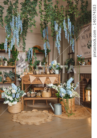 Cozy spring interior in rustic style with flowers and Easter decor 140374383