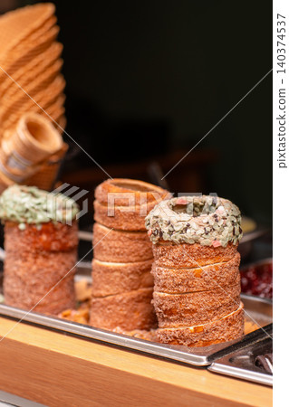 Fresh chimney cakes on display at bakery stall with copy space 140374537