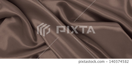 Smooth elegant brown silk or satin luxury cloth texture as abstract background. Luxurious background design. In Sepia toned. Retro style Smooth elegant brown silk or satin luxury cloth texture as abstract background. Luxurious background design. In Sepia toned. Retro style 140374582