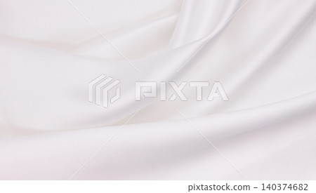 Smooth elegant white silk or satin luxury cloth texture as wedding background. Luxurious background design Smooth elegant white silk or satin luxury cloth texture as wedding background. Luxurious background design 140374682