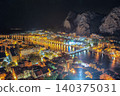 Awesome aerial panoramic view of Old Town Omis , Cetina river and mountains at night. 140375031