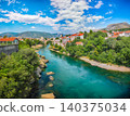 Awesome Skyline of Mostar with the Mostar Bridge, houses and minarets, during sunny day. 140375034