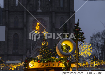 Christmas market stall Trdelnik food and Church of Saint Ludmila Christmas market stall Trdelnik food and Church of Saint Ludmila 140375485