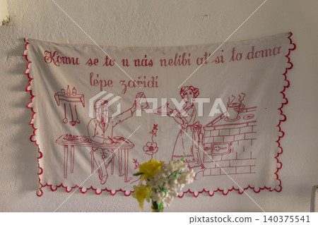 Czech traditional kitchen embroidery featuring domestic proverb Czech traditional kitchen embroidery featuring domestic proverb 140375541