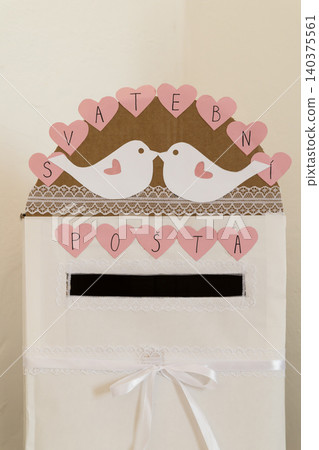 White wedding post box with heart decorations and doves White wedding post box with heart decorations and doves 140375561