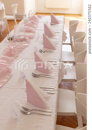 Table setting arranged for a formal dining event Table setting arranged for a formal dining event 140375562