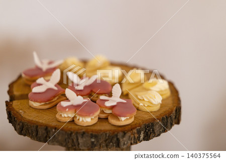 Heart cookies with dove decorations on wood stand Heart cookies with dove decorations on wood stand 140375564