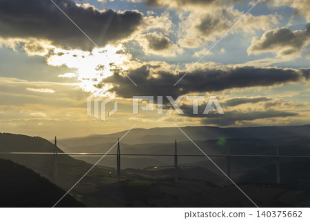 Millau Viaduct spanning valley at sunset, Creissels Millau Viaduct spanning valley at sunset, Creissels 140375662