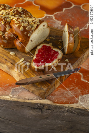 Challah bread slices with strawberry jam for breakfast Challah bread slices with strawberry jam for breakfast 140375694