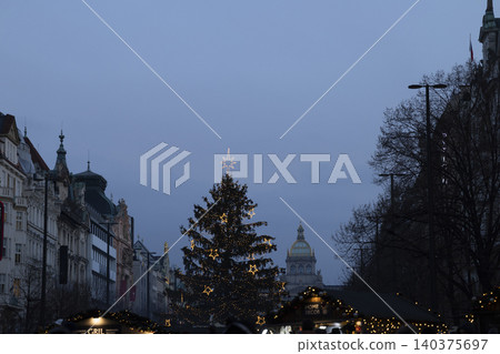 Christmas tree glowing in namesti Miru Prague evening Christmas tree glowing in namesti Miru Prague evening 140375697