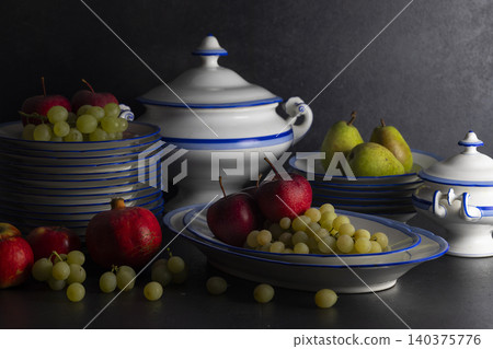 Still life displaying traditional ceramics with fresh fruit Still life displaying traditional ceramics with fresh fruit 140375776