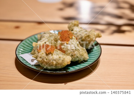 Aosa seaweed zeppole with salmon roe Aosa seaweed zeppole with salmon roe 140375841