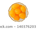 Fermented apricots and healthy eating. Pickles in plate isolated on white background. Top view of fruits. 140376203