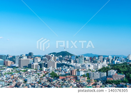 Panoramic view of downtown Seoul city skyline and Namsan Seoul Tower from Inwangsan Mountain on a clear summer day Panoramic view of downtown Seoul city skyline and Namsan Seoul Tower from Inwangsan Mountain on a clear summer day 140376305