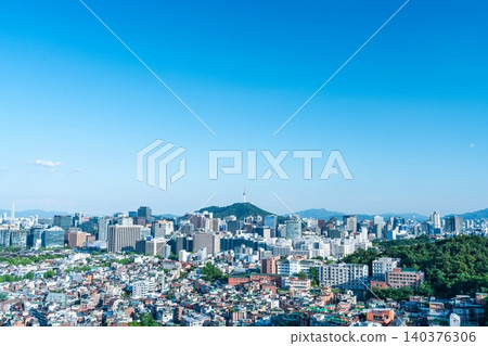 Panoramic view of downtown Seoul city skyline and Namsan Seoul Tower from Inwangsan Mountain on a clear summer day Panoramic view of downtown Seoul city skyline and Namsan Seoul Tower from Inwangsan Mountain on a clear summer day 140376306