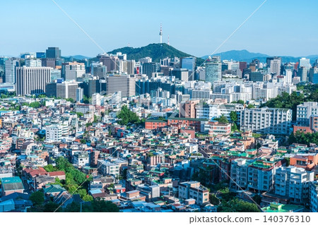 Panoramic view of downtown Seoul city skyline and Namsan Seoul Tower from Inwangsan Mountain on a clear summer day Panoramic view of downtown Seoul city skyline and Namsan Seoul Tower from Inwangsan Mountain on a clear summer day 140376310