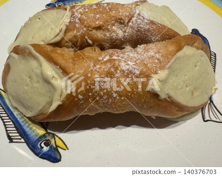 Cannoli, a Sicilian pastry filled with pistachio cream. Cannoli, a Sicilian pastry filled with pistachio cream. 140376703
