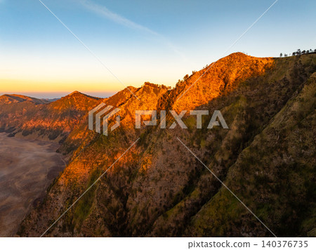 Amazing Mount Bromo volcano during sunrise from king kong viewpoint on Mountain Penanjakan in Bromo Tengger Semeru National Park,East Java,Indonesia.Nature landscape background Amazing Mount Bromo volcano during sunrise from king kong viewpoint on Mountain Penanjakan in Bromo Tengger Semeru National Park,East Java,Indonesia.Nature landscape background 140376735