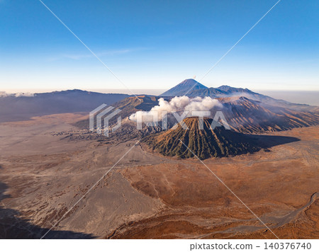 Amazing Mount Bromo volcano during sunrise from king kong viewpoint on Mountain Penanjakan in Bromo Tengger Semeru National Park,East Java,Indonesia.Nature landscape background Amazing Mount Bromo volcano during sunrise from king kong viewpoint on Mountain Penanjakan in Bromo Tengger Semeru National Park,East Java,Indonesia.Nature landscape background 140376740