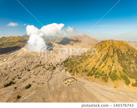 Amazing Mount Bromo volcano during sunrise from king kong viewpoint on Mountain Penanjakan in Bromo Tengger Semeru National Park,East Java,Indonesia.Nature landscape background Amazing Mount Bromo volcano during sunrise from king kong viewpoint on Mountain Penanjakan in Bromo Tengger Semeru National Park,East Java,Indonesia.Nature landscape background 140376743