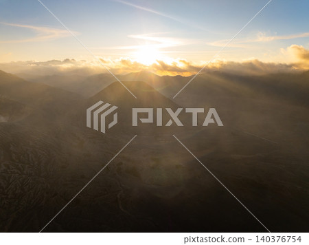 Amazing Mount Bromo volcano during sunrise from king kong viewpoint on Mountain Penanjakan in Bromo Tengger Semeru National Park,East Java,Indonesia.Nature landscape background Amazing Mount Bromo volcano during sunrise from king kong viewpoint on Mountain Penanjakan in Bromo Tengger Semeru National Park,East Java,Indonesia.Nature landscape background 140376754