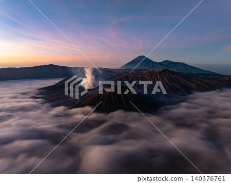 Amazing Mount Bromo volcano during sunrise from king kong viewpoint on Mountain Penanjakan in Bromo Tengger Semeru National Park,East Java,Indonesia.Nature landscape background Amazing Mount Bromo volcano during sunrise from king kong viewpoint on Mountain Penanjakan in Bromo Tengger Semeru National Park,East Java,Indonesia.Nature landscape background 140376761