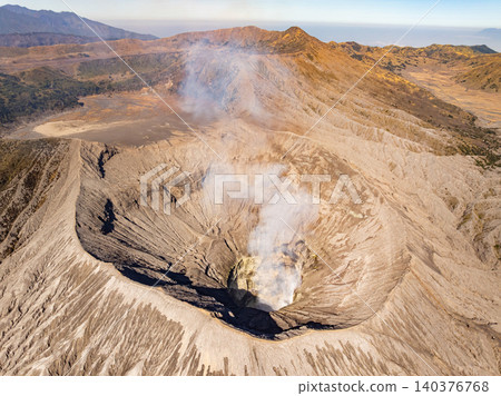 Amazing Mount Bromo volcano during sunrise from king kong viewpoint on Mountain Penanjakan in Bromo Tengger Semeru National Park,East Java,Indonesia.Nature landscape background Amazing Mount Bromo volcano during sunrise from king kong viewpoint on Mountain Penanjakan in Bromo Tengger Semeru National Park,East Java,Indonesia.Nature landscape background 140376768
