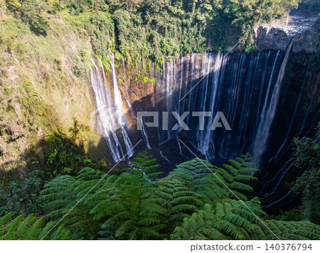 Aerial view of the Tumpak Sewu Waterfalls also known as Coban Sewu.Beautiful Tumpak Sewu Waterfalls are a tourist attraction in East Java, Indonesia.Amazing travel destination in asia 140376794