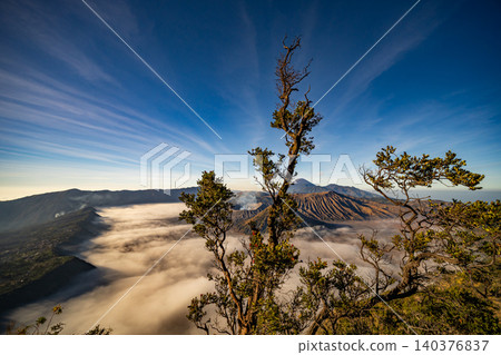 Amazing Mount Bromo volcano during sunrise from king kong viewpoint on Mountain Penanjakan in Bromo Tengger Semeru National Park,East Java,Indonesia.Nature landscape background Amazing Mount Bromo volcano during sunrise from king kong viewpoint on Mountain Penanjakan in Bromo Tengger Semeru National Park,East Java,Indonesia.Nature landscape background 140376837