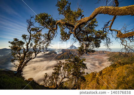 Amazing Mount Bromo volcano during sunrise from king kong viewpoint on Mountain Penanjakan in Bromo Tengger Semeru National Park,East Java,Indonesia.Nature landscape background Amazing Mount Bromo volcano during sunrise from king kong viewpoint on Mountain Penanjakan in Bromo Tengger Semeru National Park,East Java,Indonesia.Nature landscape background 140376838