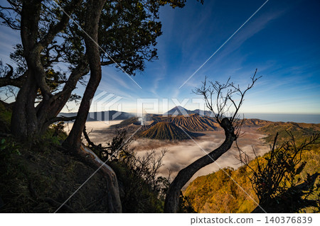 Amazing Mount Bromo volcano during sunrise from king kong viewpoint on Mountain Penanjakan in Bromo Tengger Semeru National Park,East Java,Indonesia.Nature landscape background Amazing Mount Bromo volcano during sunrise from king kong viewpoint on Mountain Penanjakan in Bromo Tengger Semeru National Park,East Java,Indonesia.Nature landscape background 140376839