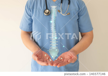 Doctor hands holding anatomy of spine for diagnosis and treatment. Awareness of herniated discs, scoliosis, and spinal stenosis. Orthopedic concept. Doctor hands holding anatomy of spine for diagnosis and treatment. Awareness of herniated discs, scoliosis, and spinal stenosis. Orthopedic concept. 140377146