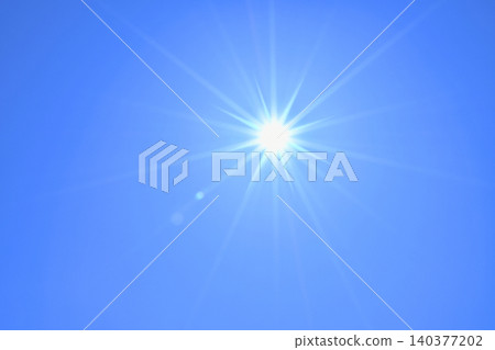 Blue sky and sun, direct sunlight, free space image 140377202