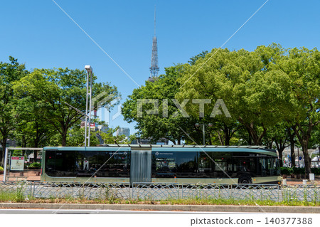 Next-generation SRT articulated buses and the TV Tower running through the Sakae area of Nagoya Next-generation SRT articulated buses and the TV Tower running through the Sakae area of Nagoya 140377388