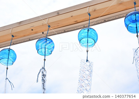 Four cool wind chimes swaying in the breeze Four cool wind chimes swaying in the breeze 140377654