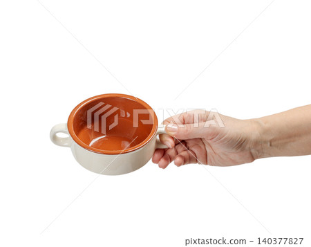 Woman's hand holding a cooking bowl on the white background. 140377827