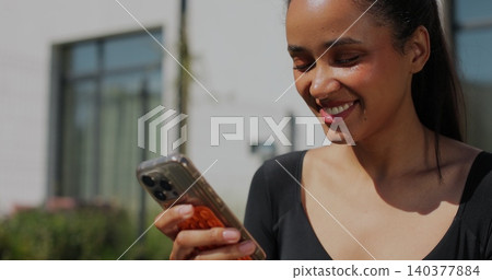 Close up girl uses the phone during training. Young woman resting after training. Close up girl uses the phone during training. Young woman resting after training. 140377884