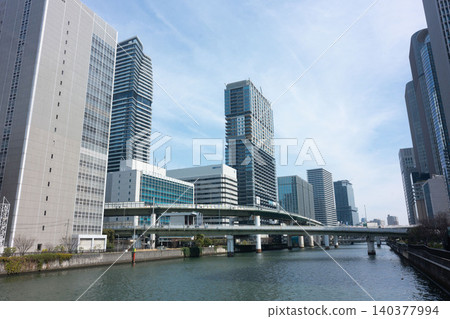 The Dojima River, the elevated Hanshin Expressway, and the cluster of skyscrapers towering over Nakanoshima. The Dojima River, the elevated Hanshin Expressway, and the cluster of skyscrapers towering over Nakanoshima. 140377994