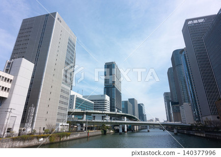 The Dojima River, the elevated Hanshin Expressway, and the cluster of skyscrapers towering over Nakanoshima. The Dojima River, the elevated Hanshin Expressway, and the cluster of skyscrapers towering over Nakanoshima. 140377996